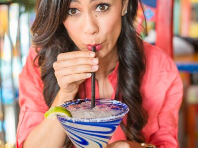 Young Hispanic Women At Mexican Restuarant Drinking Margarita