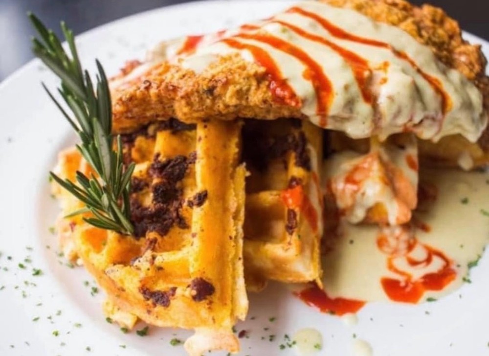 chicken an waffles and a restaurant in Dallas during a food tour