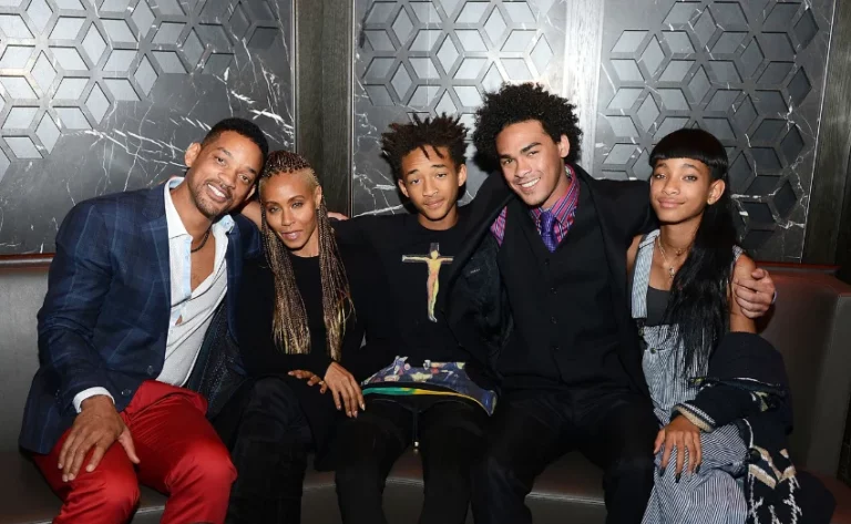 A group of celebrities, including Will Smith, Jada Pinkett Smith, Jaden Smith, Trey Smith, and Willow Smith, posing together at an event in Las Vegas