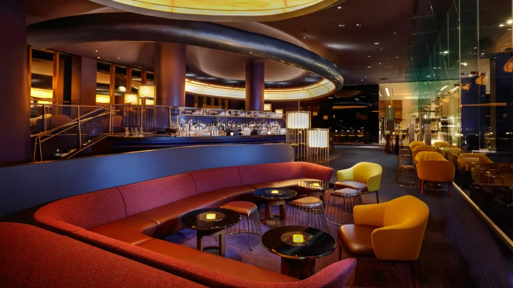 Luxurious bar in Las Vegas with modern decor, featuring a sleek bar counter, stylish seating, and ambient lighting