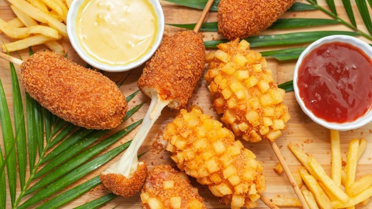 Korean corn dogs with fries and dipping sauces at a Chinatown Las Vegas restaurant