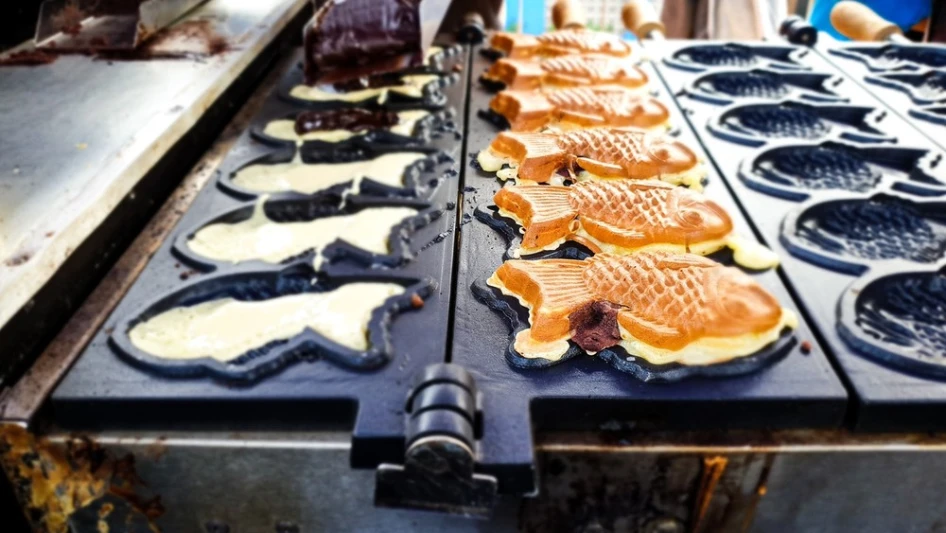 Taiyaki, fish-shaped cakes cooking in molds at a Chinatown Las Vegas restaurant.