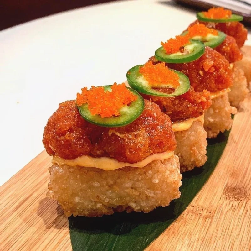 Crispy rice topped with spicy tuna, jalapeño slices, and roe at a restaurant on the Las Vegas Strip